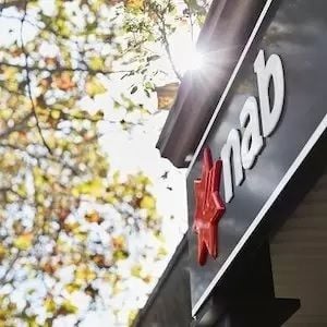 NAB earnings take $1.1 billion hit