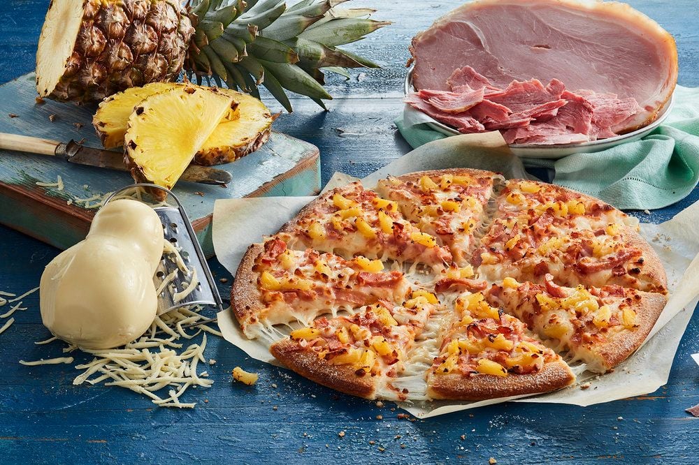 Domino's earnings growth pushes shares past $100 for the first time