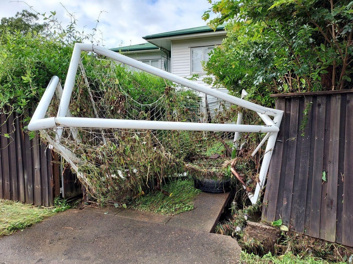 Flooding from Brisbane's Enoggera Creek swept up a soccer goalpost that was slammed into a house on Ashgrove Avenue.