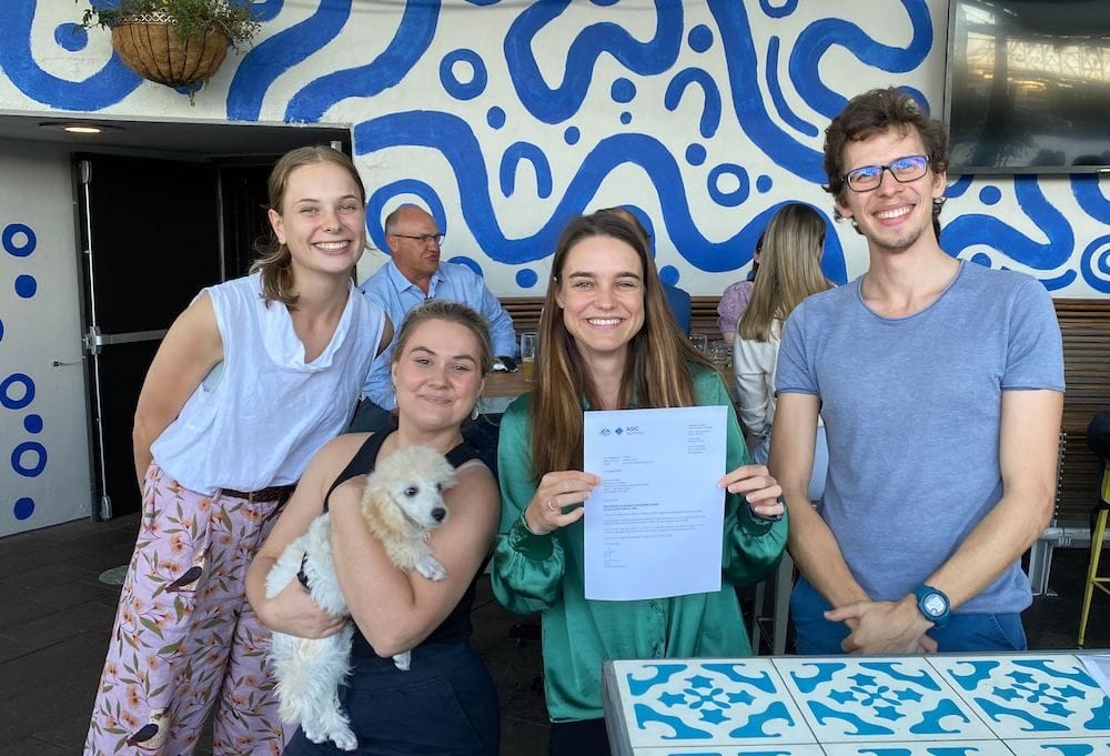 Camille Socquet-Clerc and Bertrand Caron celebrating with friends after receiving ASIC acceptance. 