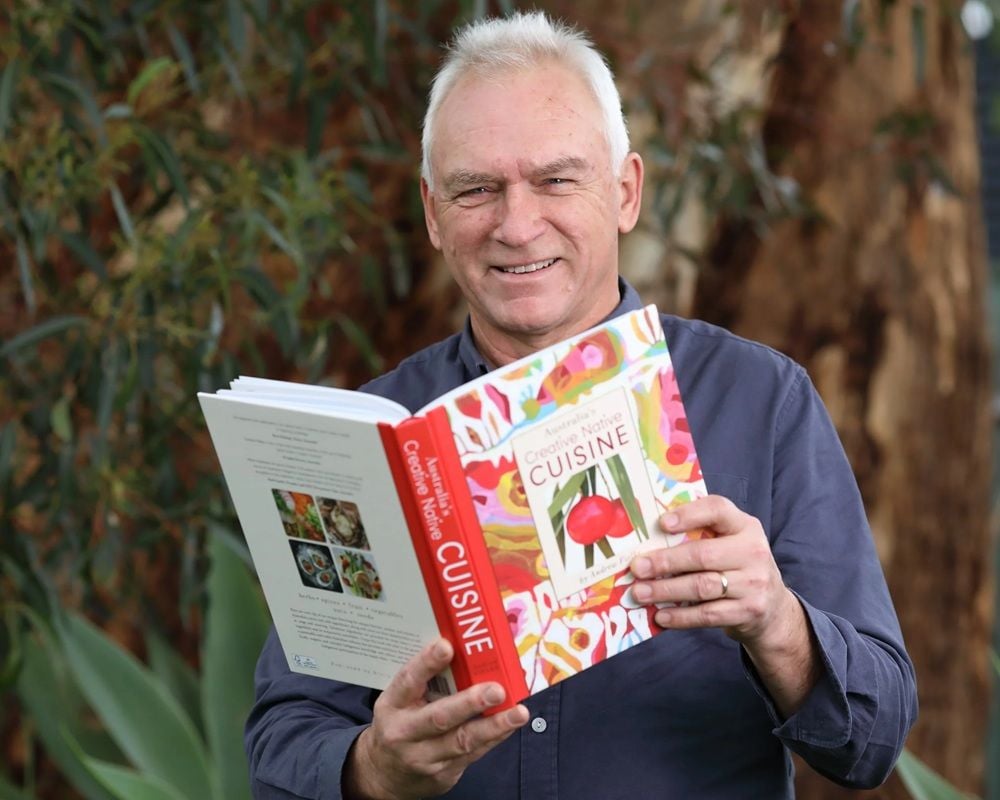 Creative Native Foods founder Andrew Fielke with his cookbook.