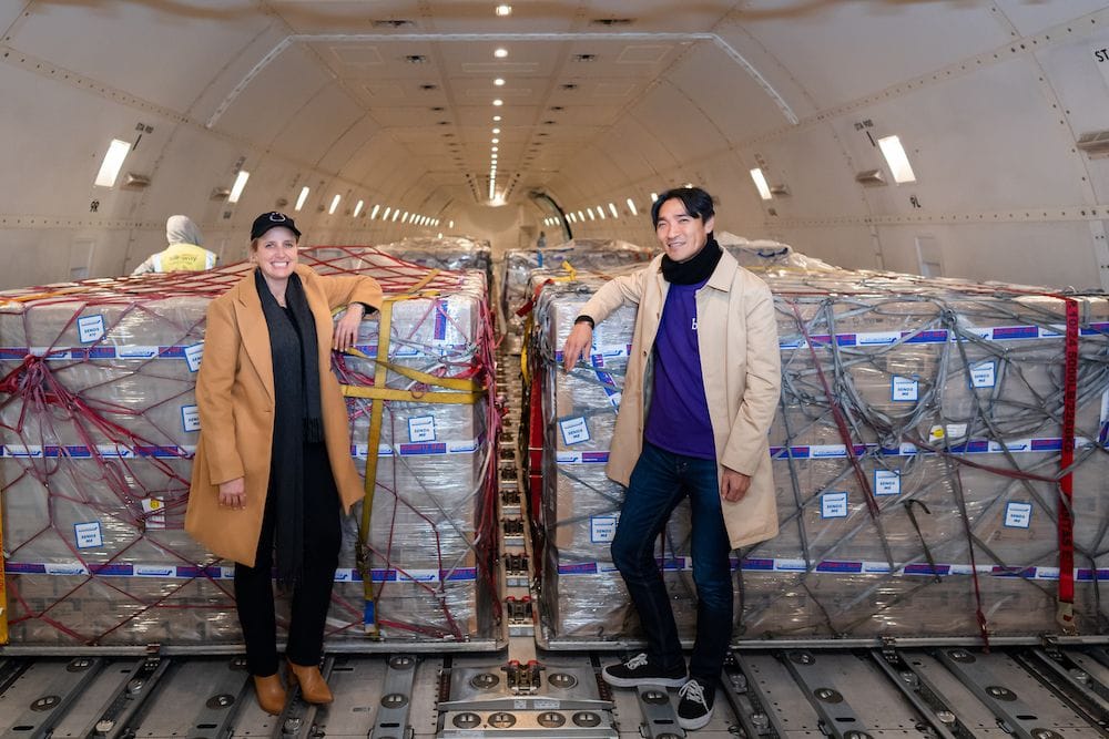 Bubs founder and CEO Kristy Carr and chairman Dennis Lin next to the first consignment of Bubs products at Melbourne’s Tullamarine Airport.