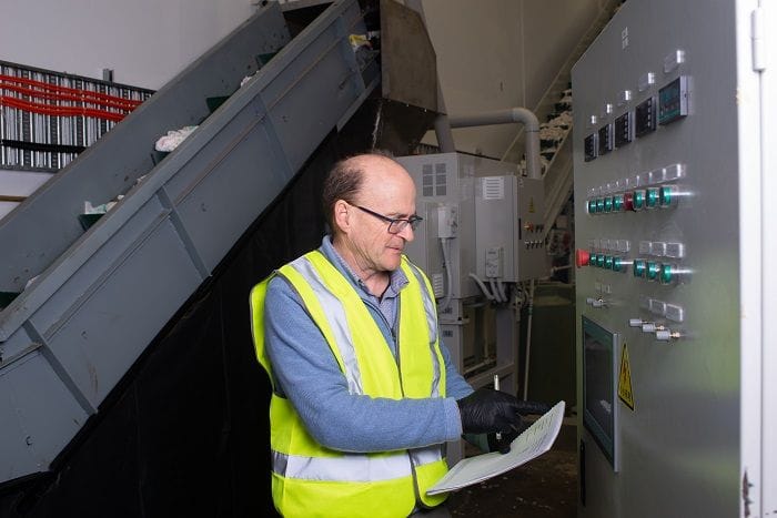 Clarke Kelland at the controls for the processing equipment.