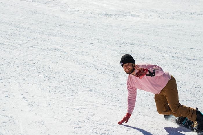 Entrepreneur Rob Joseph snowboarding while donning the Anti Ordinary 'beanie helmet'.