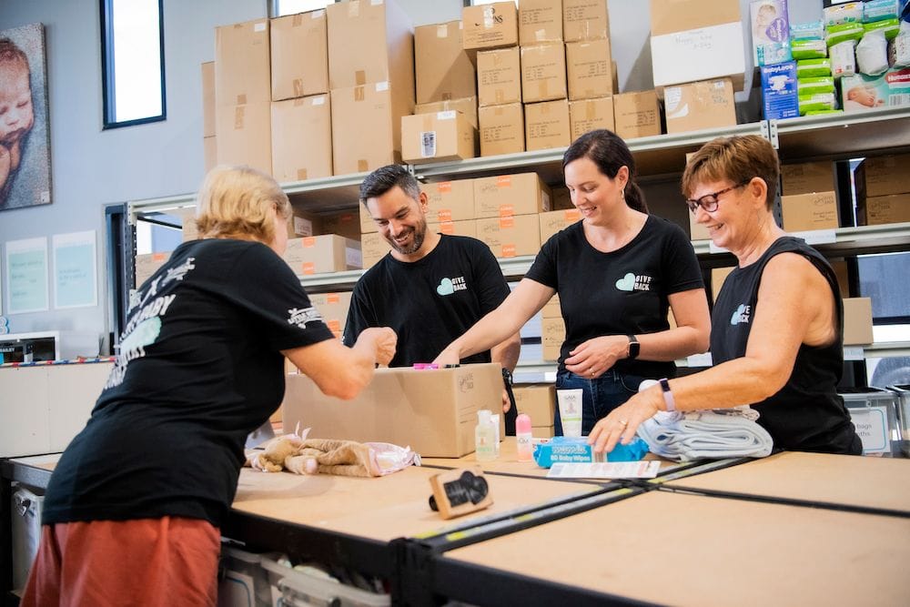 Volunteers packaging donations