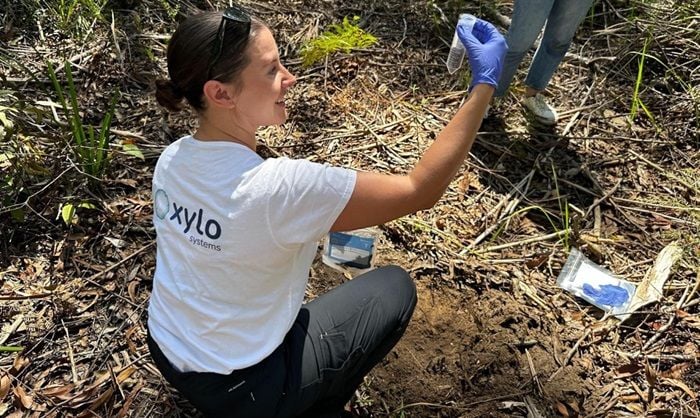 Xylo Systems co-founder and CEO Camille Goldstone-Henry sampling soil with the EnviroDNA kits.