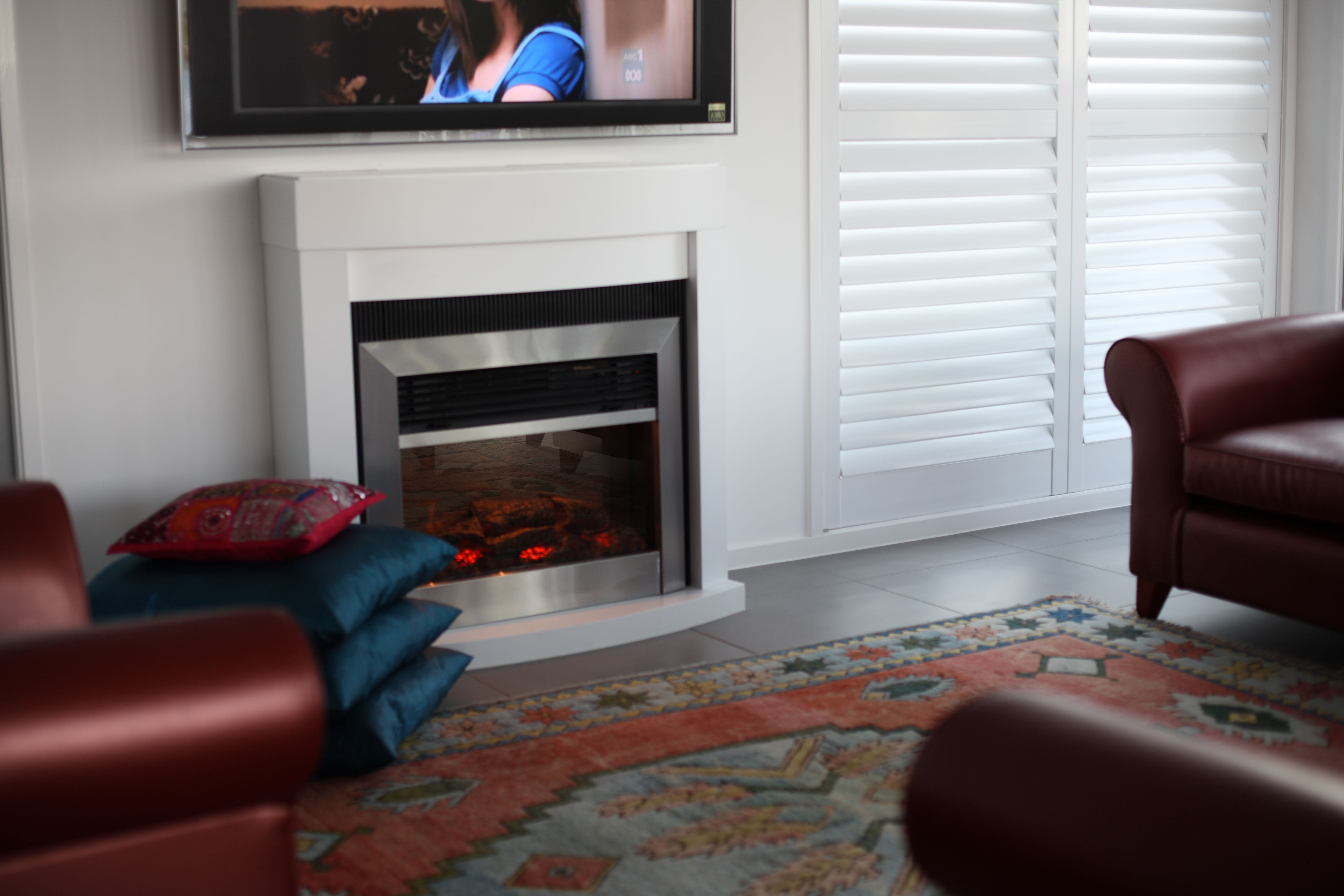 Lounge room with Australian Made PVC shutters - Retailed by Premier Shades Central Coast