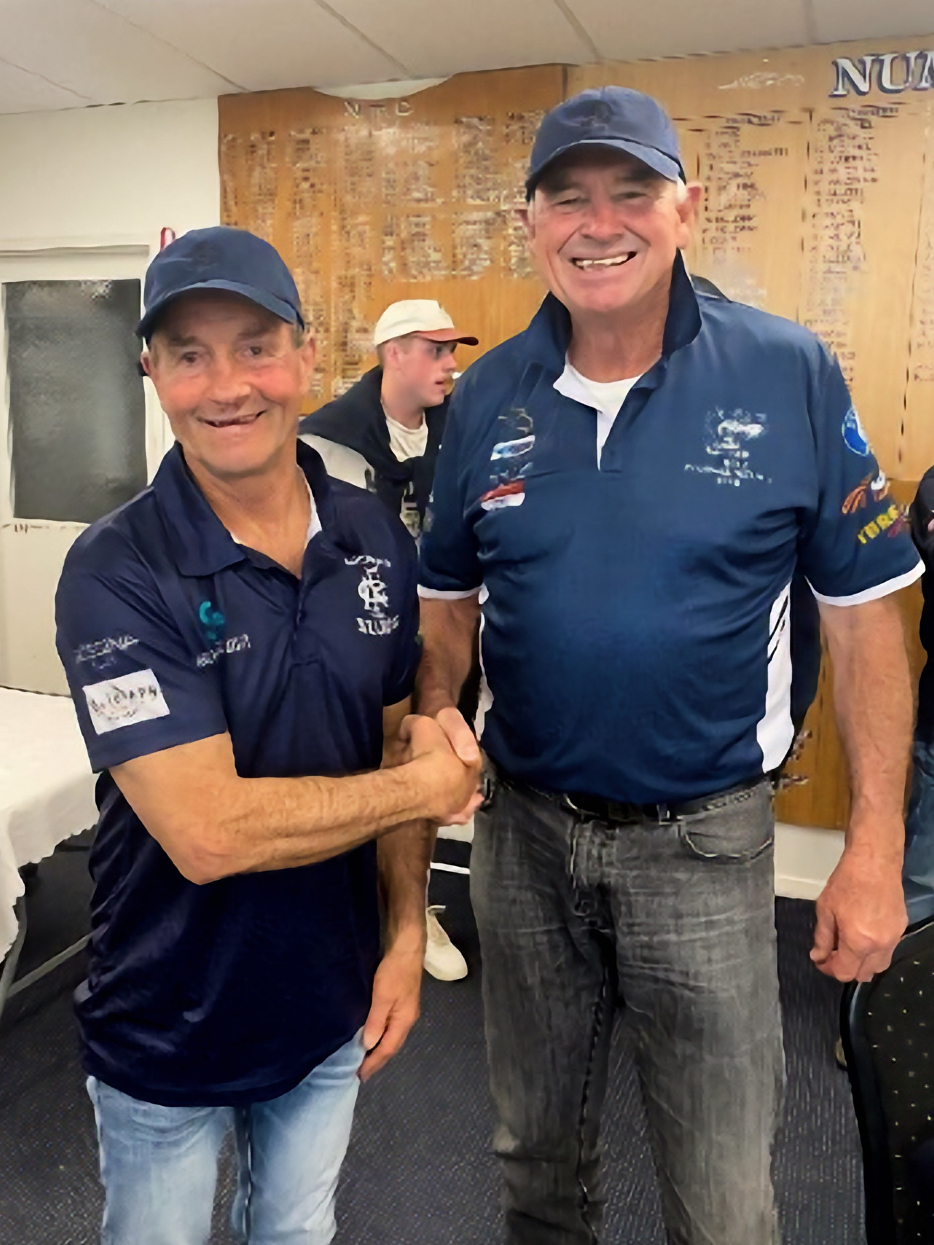 Chris Bell receiving his baggy blue from Rob Hawkins in Finley, NSW. PastPlayersandOfficials Image -69686a360422b
