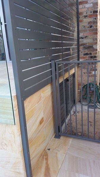3-woodland-grey-alum-slat-gates-under-patio