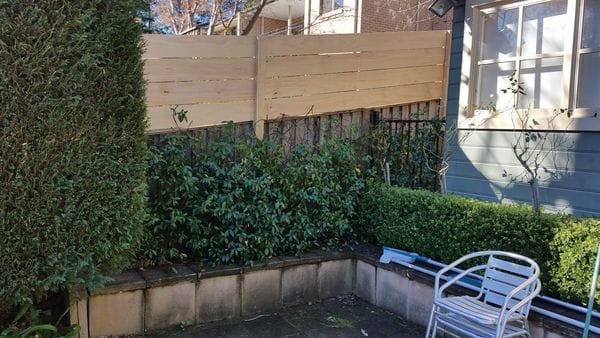 After 2 - Boundary fence was raised to 1.8m high with treated pine slats