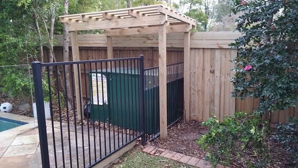 pergola over climbable pool filter box on boundary fence