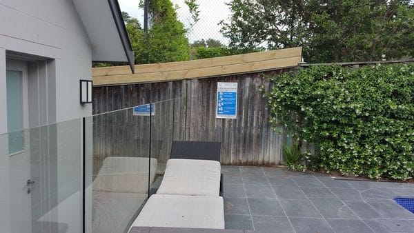 sawn-timber-slats-to-raise-pool-boundary-fence