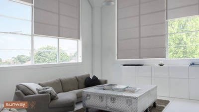 Sunway Quantum Roller Blind, fitted in living room setting. Textured translucent fabric covers windows allowing light in but maintains privacy.