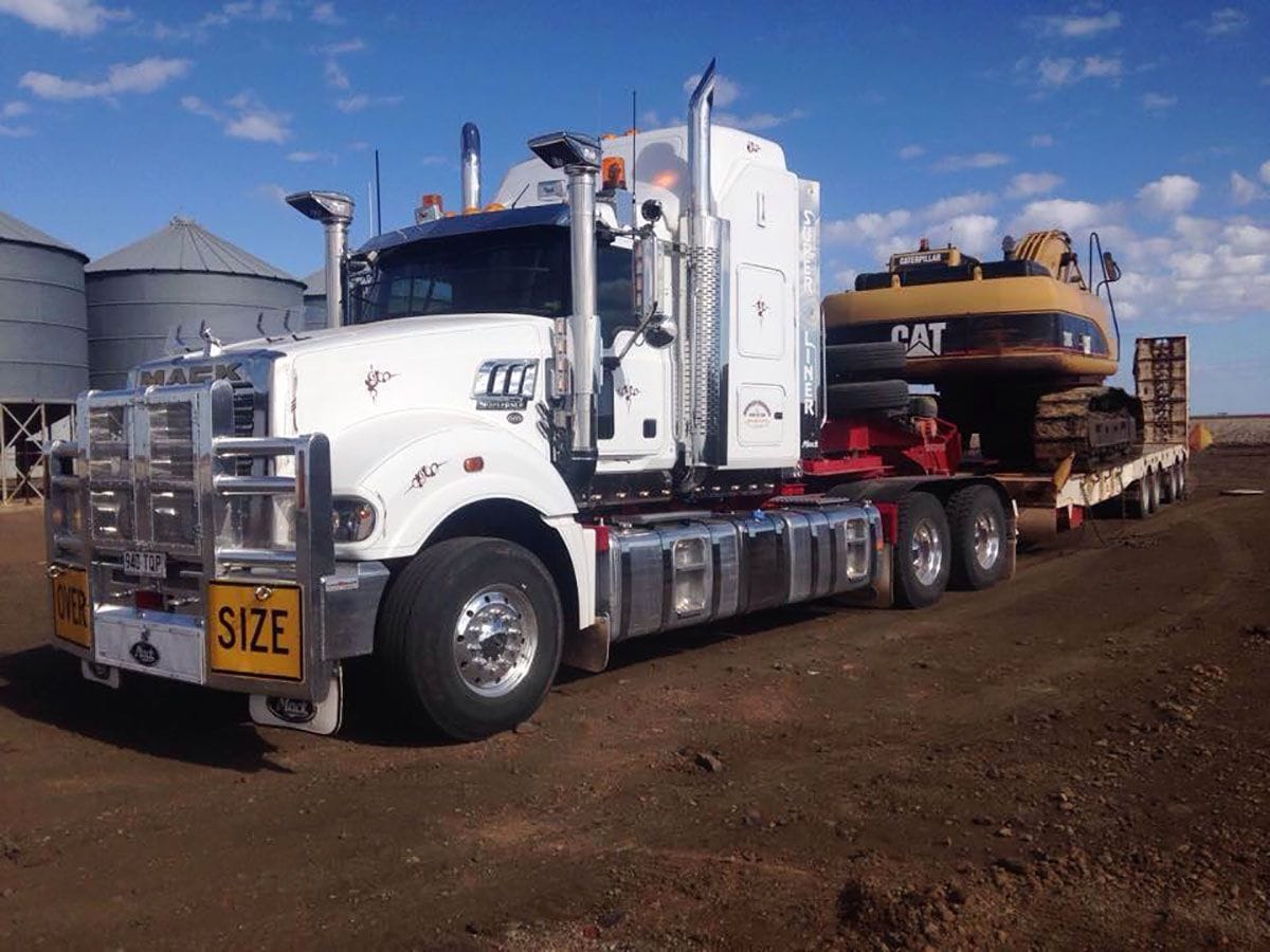Semi trailer with a track driven dozer loaded and ready for transport