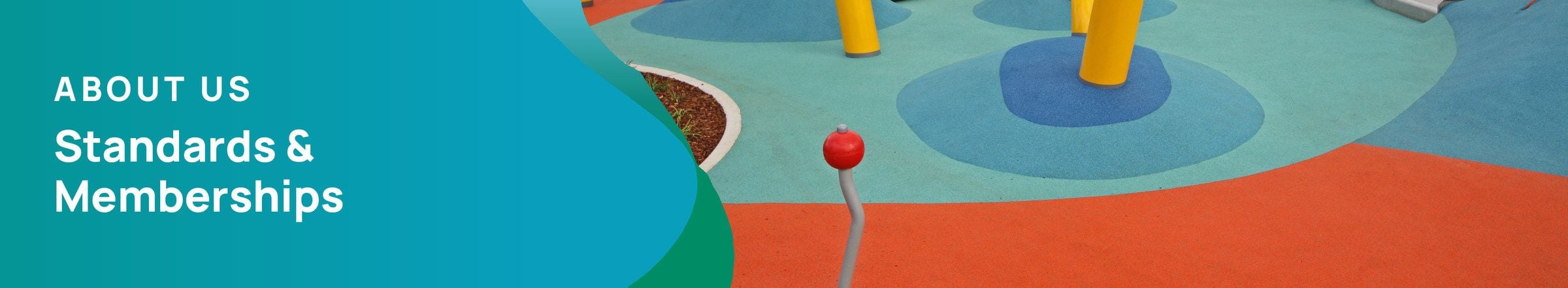 About Us: Standards & Memberships. Colourful rubber wetpour playground surfacing in orange and blue with yellow poles.