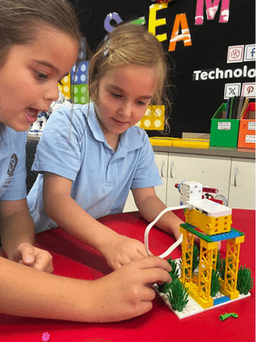 Collaborative Robotics and Coding Learning Students working together using LEGO SPIKE kits to build and code solutions