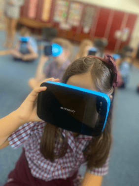Immersive Learning Through Emerging Technologies Student using virtual reality headset to explore immersive learning experiences