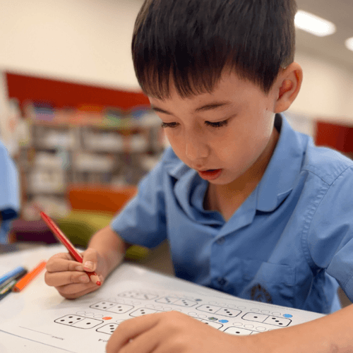 Student independently solving a mathematics problem while developing confidence, reasoning and problem-solving skills.