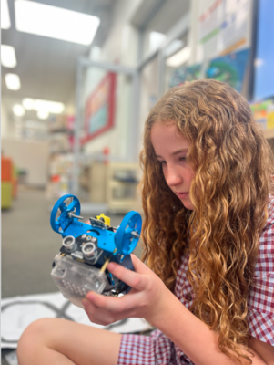Exploring robotics with LEGO Spike Prime Primary student engaging with a LEGO Spike Prime robot during a STEAM lesson