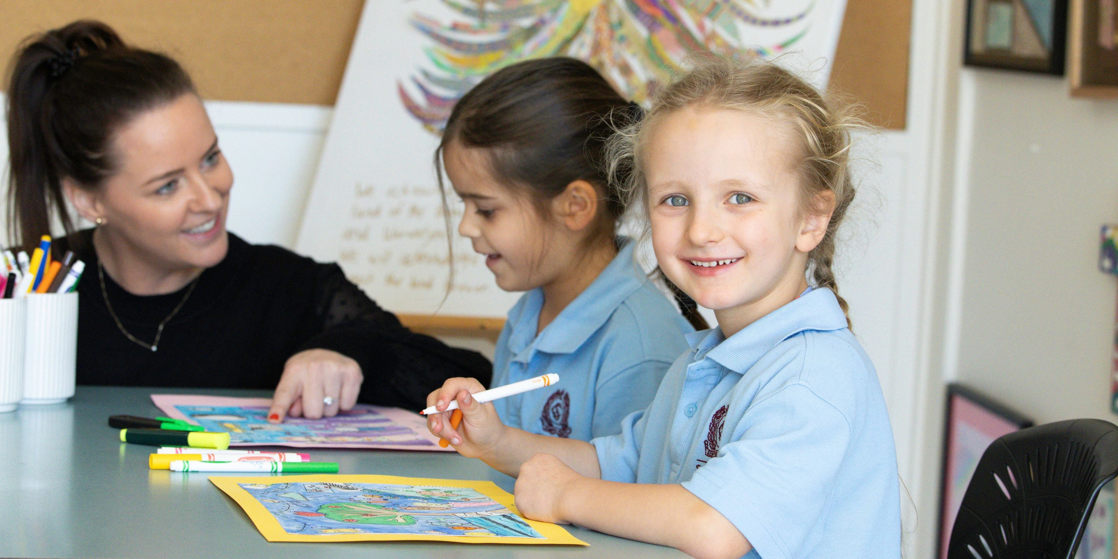 Smiling Prep students learning together in the classroom at St Columba&rsquo;s Primary School.