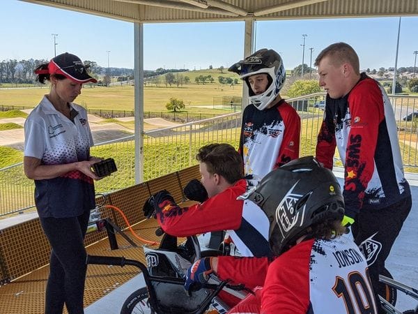 SWSAS BMX Manager Anne-Marie Moubarak shows athletes video feedback of their gate starts during the recent BMX squad session at the new Macarthur Track
