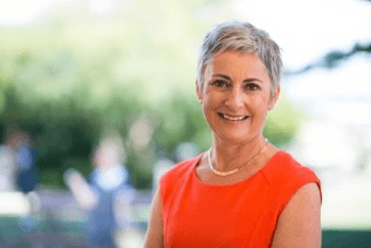 Former principal settles defamation case out of court