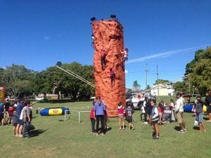 Set up at a outdoor community event with the Bungee Rock Climbing Wall. 
