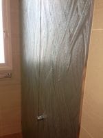 Textured Glass Door to a toilet in an ensuite for privacy.